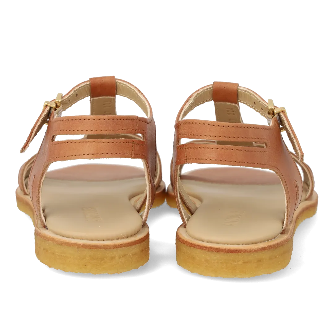 Feminine sandal with strap design